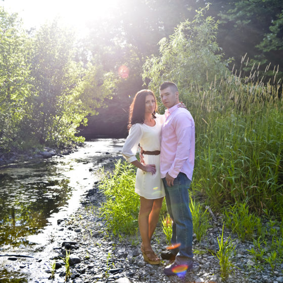 Couple by a stream
